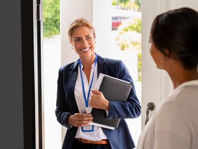 Woman social worker visiting a home